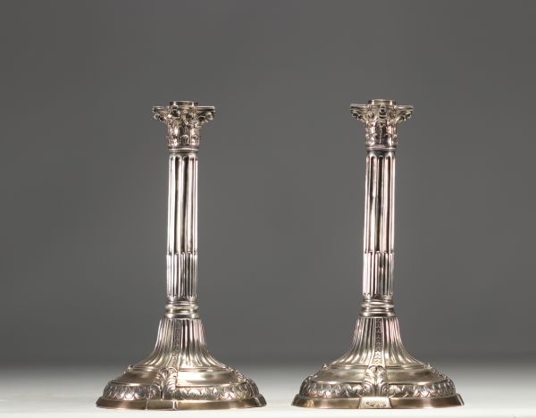 A pair of solid silver candlesticks with column decoration, hallmarked Tournai, Belgium, 18th century.