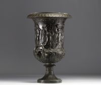 A Medici vase in bronzed brass with a black patina, decorated with a Bacchanalian frieze in the antique style, 19th century.