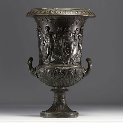 A Medici vase in bronzed brass with a black patina, decorated with a Bacchanalian frieze in the antique style, 19th century.