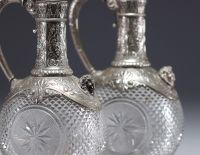 Pair of Baccarat crystal and silver wine decanters.