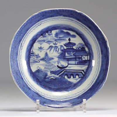 White and blue plate decorated with typical houses from China