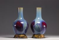 Rare pair of porcelain vases with flamed glaze mounted on bronze from 18th century