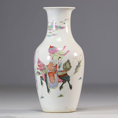 Famille rose porcelain vase decorated with characters on a white background