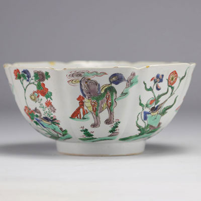 A porcelain bowl decorated with flowers and dogs with a mark under the piece, Kangxi period (1661-1722)