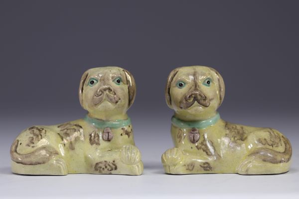 China - pair of glazed porcelain dogs with green collars.