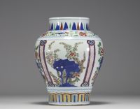 China - A 19th century polychrome porcelain vase with floral decoration.