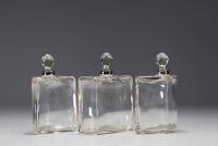 Three glass perfume bottles with silver mountings in the Empire style.