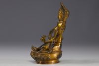 China, Tibet - Gilded bronze sculpture with stone inlays.