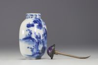 China - A blue-white porcelain snuffbox decorated with a figure, Qianlong mark under the piece.