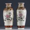 Japan - Pair of Satsuma porcelain vases with floral and butterfly decoration, Meiji period.