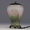 DAUM Nancy - Enamelled glass night-light decorated with a forest in the rain and wind, metal structure, signed in the decoration.