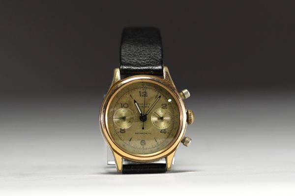 Tollet - Montre homme chronographe mécanique, boitier plaqué or, calibre Landeron, bracelet cuir, vers 1960/70.