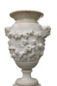 Imposing Carrara marble urn decorated with Satyrs and Putti in the Clodion style, first half of the 18th century.