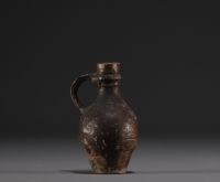 Raeren - Stoneware miniature jug with face decoration, 16th century.