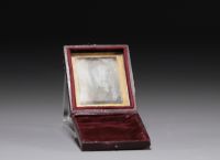 Old small souvenir box containing a mirror with a picture of a gentleman. 19th century.
