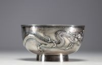 China - Large solid silver bowl decorated with dragons in relief.