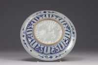 China - White and blue porcelain plate decorated with Shou-Lao, deers and figures, Ming period.