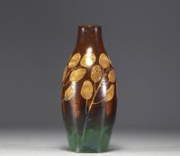 Charles CATTEAU (1880-1966) KERAMIS - Vase en grès émaillé au décor de monnaies du Pape sur fond brun et vert, signé.