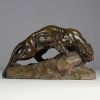 Armand FAGOTTO (19th-20th century) ‘Lionne s'abreuvant’ Sculpture in patinated terracotta, 19th-20th century, signed.