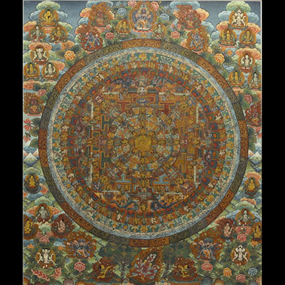 Tibet - Tanka, painting on silk decorated with divinities and bordered with embroidered silk, 19th century.