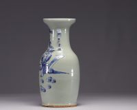 China - A blue-white porcelain vase on a celadon background decorated with figures, 19th century.