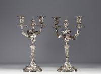 A pair of Louis XV silver-plated bronze candlesticks.