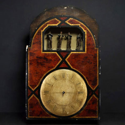 Horloge à orgue à quatre musiciens, cadran peint, chiffres romains, début du XIXème.