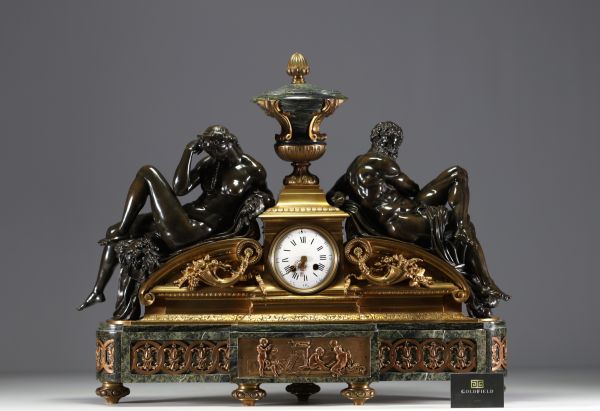 Imposing ormolu and patinated mantel clock decorated with antique figures, marble base, 19th century.