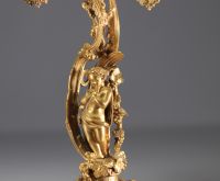 Pendue de cheminée et candélabres de style Louis XV en bronze doré, XIXe siècle.