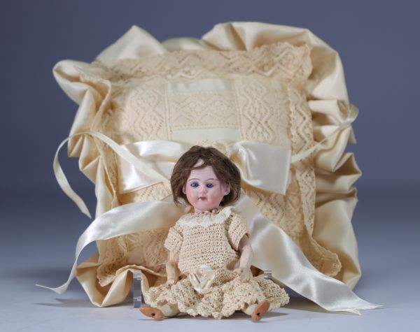 Small porcelain doll head debossed with 