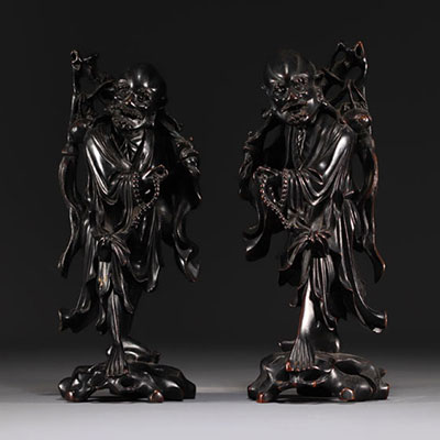 China, Vietnam - Pair of exotic wood carvings representing two figures.