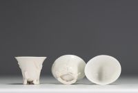 China - Set of three white porcelain libatory bowls.