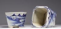 China - Pair of blue-white porcelain planters with landscape decoration, Qing period.