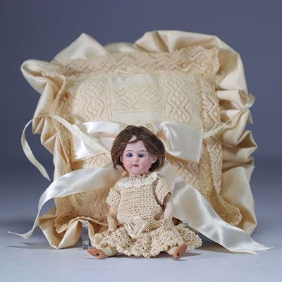 Small porcelain doll head debossed with 