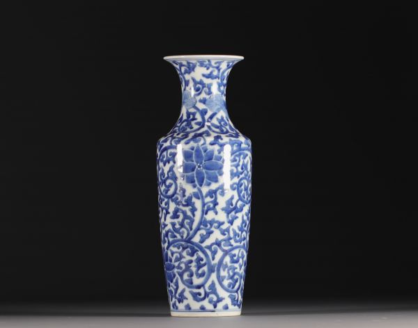 China - A white-blue porcelain baluster vase decorated with lotus flowers, double circle mark, Qing period.