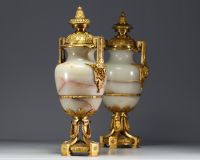 Imposing pair of Louis XVI chased gilt bronze and onyx cassolettes.