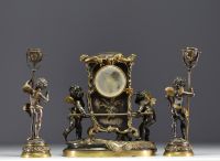 Auguste MOREAU (1834-1917) Gilt and silvered bronze clock and two candlesticks with putti decoration, signed Aug. Moreau, 19th century.