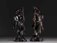 China, Vietnam - Pair of exotic wood carvings representing two figures.