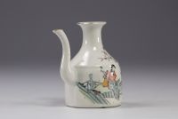 China - Famille rose porcelain teapot decorated with characters.