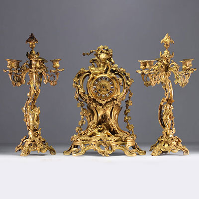 Louis XV style gilt bronze mantelpiece and candelabra, 19th century.