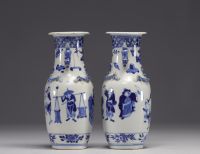 China - Pair of blue-white porcelain vases with figures, Kangxi mark, 19th century.