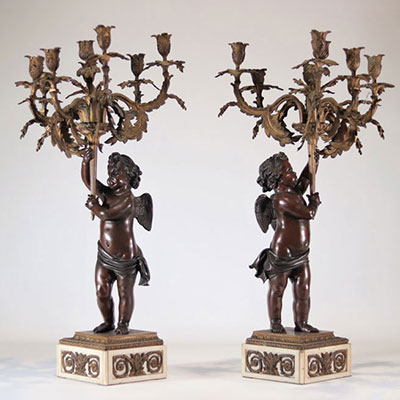 Pair of large bronze candelabras with two angel patinas carrying Louis XV style candlesticks