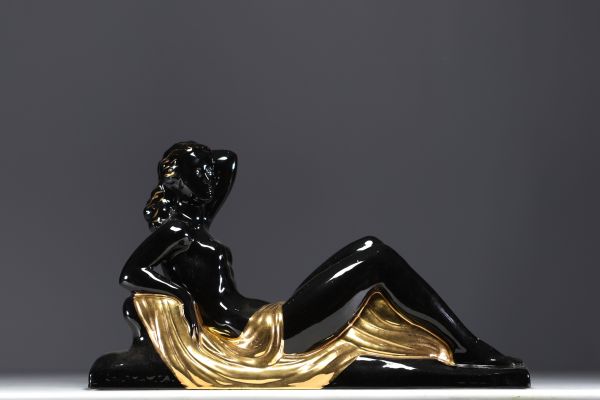 Charles LEMANCEAU ‘Reclining Woman’ Art Deco sculpture in black and gold ceramic.