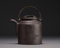 China - Yixing violet clay teapot in its box, 20th century.