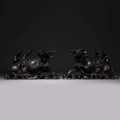 China Vietnam - Pair of wooden sculptures decorated with water buffaloes and figures.