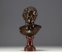 ‘Young Faun’ bronze bust with brown patina on marble base, mark of the Fonderie Nationale des Bronzes ’J. Petermann, Brussels’.