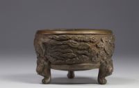 China, bronze perfume burner decorated with phoenixes in clouds, lion-headed feet, Qing period.