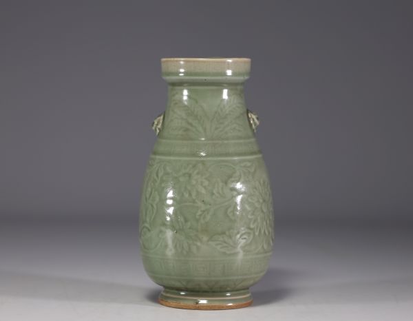 China - Celadon monochrome porcelain vase with floral design in relief.