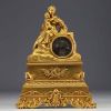 ‘Reading’ Gilt bronze clock decorated with a woman and child, 19th century.