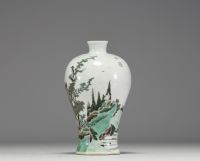 China - A polychrome porcelain vase decorated with pine trees and a figure, mark on the piece, 19th century.